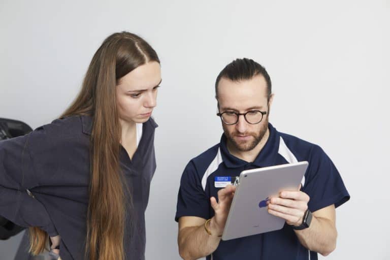 Podiatrist explaining to patient with Ipad